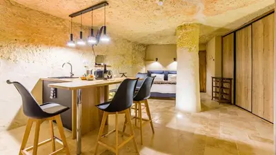 Un ou plusieurs lits dans un hébergement de l'établissement Le Clos Baudoin B&B Troglo