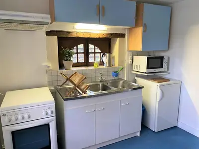 Cuisine ou kitchenette dans l'établissement Le Moulin de Pasnel