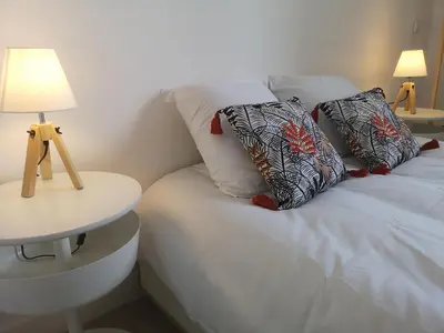 Un ou plusieurs lits dans un hébergement de l'établissement Happy Kool - centre ville + wifi + parking privé