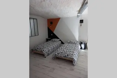 Un ou plusieurs lits dans un hébergement de l'établissement La Trog'Laudy gîte 4 étoiles au coeur des vignes