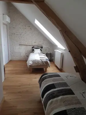 Un ou plusieurs lits dans un hébergement de l'établissement Gîte Les Nymphéas