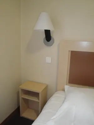 Un ou plusieurs lits dans un hébergement de l'établissement Cit'Hotel Talencia