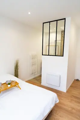 Un ou plusieurs lits dans un hébergement de l'établissement Appartement confort avec parking privé à Saumur