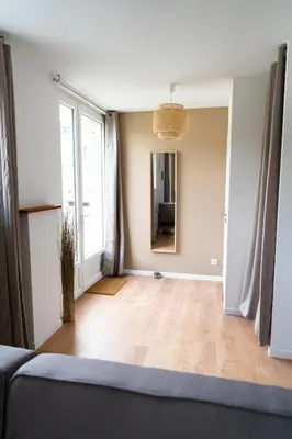 Un ou plusieurs lits dans un hébergement de l'établissement Appartement cosy avec parking privé à Saumur