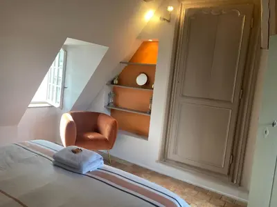 Un ou plusieurs lits dans un hébergement de l'établissement Chambre Capucine