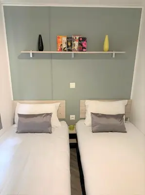 Un ou plusieurs lits dans un hébergement de l'établissement MOBILHOME 3 CH CAMPING 4*