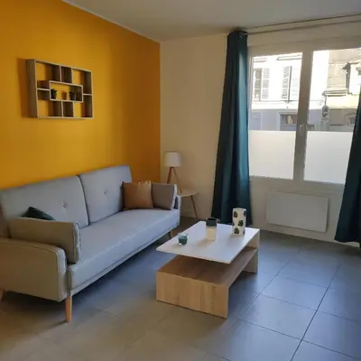 Coin salon dans l'établissement Appartement Cosy avec place de parking privée