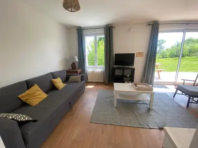 Coin salon dans l'établissement Maison des Grands Champs