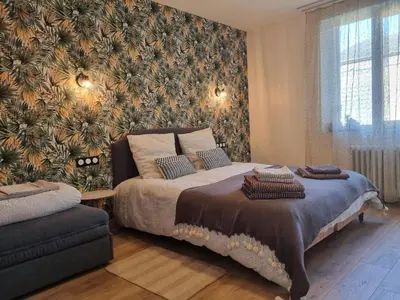 Un ou plusieurs lits dans un hébergement de l'établissement Appartement à la campagne avec piscine