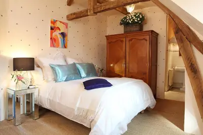 Un ou plusieurs lits dans un hébergement de l'établissement Une Maison, Un Jardin
