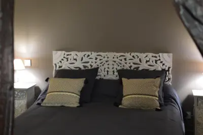 Un ou plusieurs lits dans un hébergement de l'établissement LA MAISON DE TRIBOULET Chambres et table d'hôtes -Amboise-