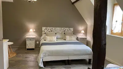 Un ou plusieurs lits dans un hébergement de l'établissement LA MAISON DE TRIBOULET Chambres et table d'hôtes -Amboise-