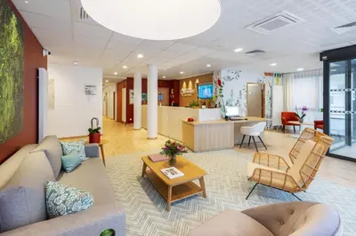 Coin salon dans l'établissement Résidence Le Mans