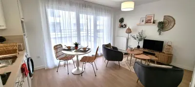 Télévision ou salle de divertissement dans l'établissement Résidence Le Mans