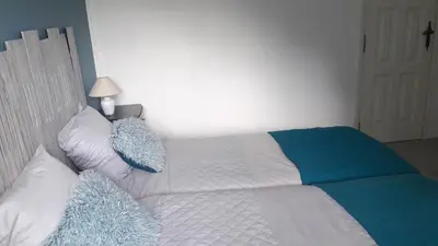 Un ou plusieurs lits dans un hébergement de l'établissement Chez Sally et Mario