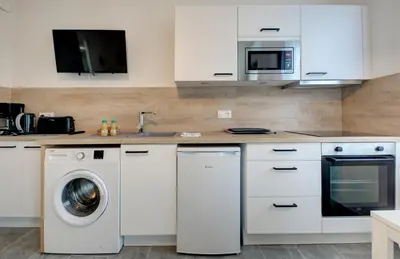 Cuisine ou kitchenette dans l'établissement Les forges 2 pièces RDC