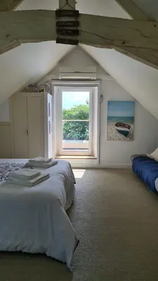 Un ou plusieurs lits dans un hébergement de l'établissement La coudraie votre maison de vacances en famille