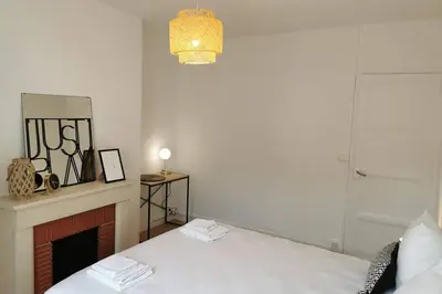 Un ou plusieurs lits dans un hébergement de l'établissement Le LORENZO - hypercentre, cosy et vue Loire