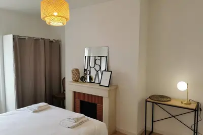 Un ou plusieurs lits dans un hébergement de l'établissement Le LORENZO - hypercentre, cosy et vue Loire