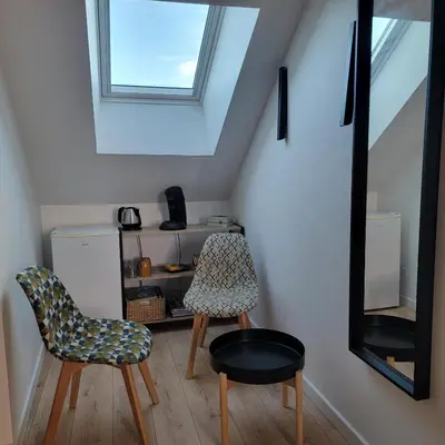 Coin salon dans l'établissement En pleine campagne, proche du Mans - chambre d'hôtes
