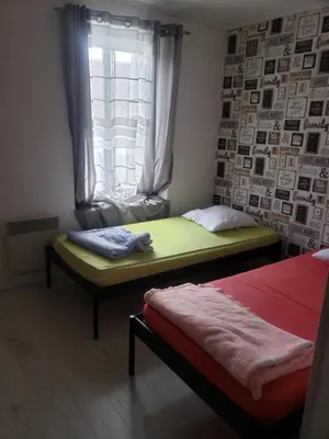 Un ou plusieurs lits dans un hébergement de l'établissement Maison familiale à 10min du Zoo Parc de Beauval