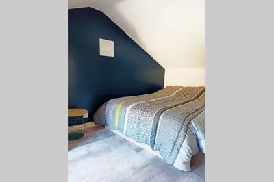 Un ou plusieurs lits dans un hébergement de l'établissement Petite maison de charme