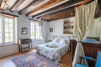Un ou plusieurs lits dans un hébergement de l'établissement Maison d'hôtes Moulin du Bas Pesé