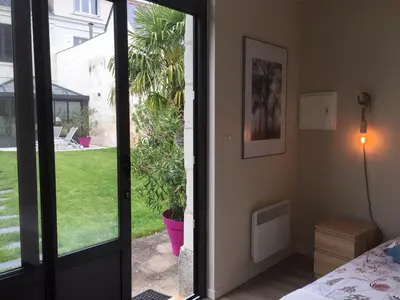 Jardin de l'établissement Chambre dans dépendance Maison de Ville + abri vélos