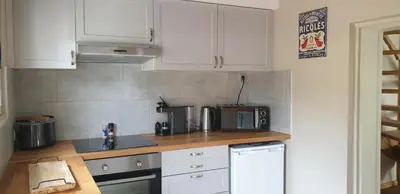 Cuisine ou kitchenette dans l'établissement La petite maison