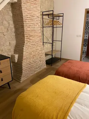 Un ou plusieurs lits dans un hébergement de l'établissement La Charmeraie : gîte de charme, piscine et spa
