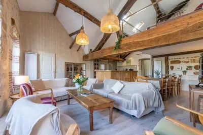 Un ou plusieurs lits dans un hébergement de l'établissement Loft de La Maison des Chalands