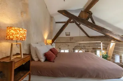 Un ou plusieurs lits dans un hébergement de l'établissement Loft de La Maison des Chalands