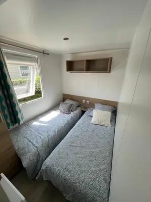 Un ou plusieurs lits dans un hébergement de l'établissement Mobil-Home 4 étoiles avec piscine proche de Blois
