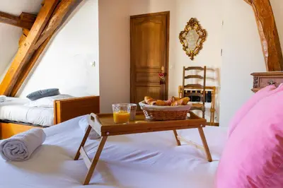 Un ou plusieurs lits dans un hébergement de l'établissement Maison Camilia