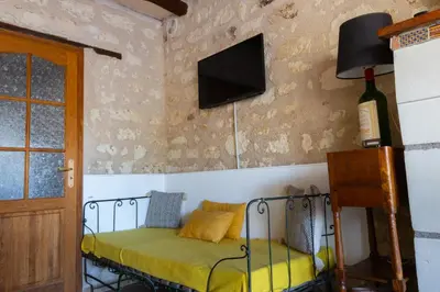 Télévision ou salle de divertissement dans l'établissement Maison Camilia