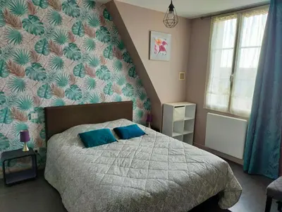 Un ou plusieurs lits dans un hébergement de l'établissement Jolie maison atypique à Montrichard