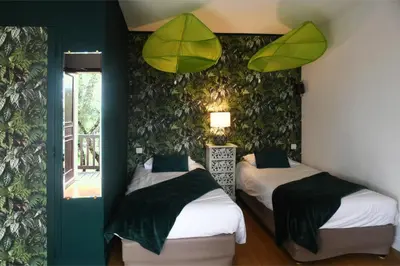 Un ou plusieurs lits dans un hébergement de l'établissement Logis Auberge De Launay
