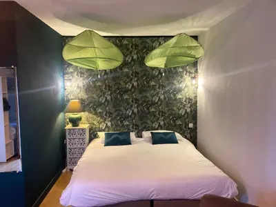 Un ou plusieurs lits dans un hébergement de l'établissement Logis Auberge De Launay