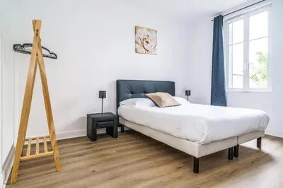 Un ou plusieurs lits dans un hébergement de l'établissement Maison tout confort, parking, clim, garage 3ch 5p