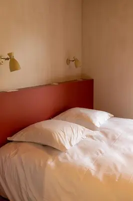 Un ou plusieurs lits dans un hébergement de l'établissement Gite de Vonnes