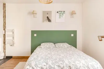 Un ou plusieurs lits dans un hébergement de l'établissement Maison tourangelle chic & cosy avec cour
