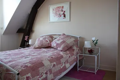 Un ou plusieurs lits dans un hébergement de l'établissement Gîte Maison de Sophie