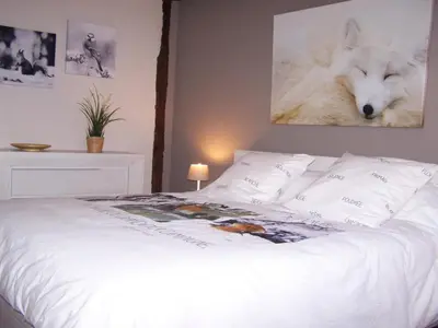 Un ou plusieurs lits dans un hébergement de l'établissement Gîte Grandeur Nature