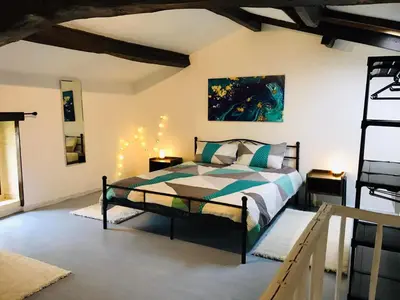 Un ou plusieurs lits dans un hébergement de l'établissement Gîte Au Boom Coeur en options SPA et Repas