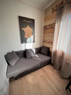 Coin salon dans l'établissement Balade en Forêt, 3min du Zoo