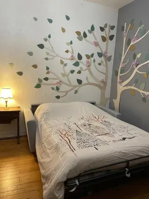 Un ou plusieurs lits dans un hébergement de l'établissement L Ensorcel Mans, séjour magique en coeur de ville