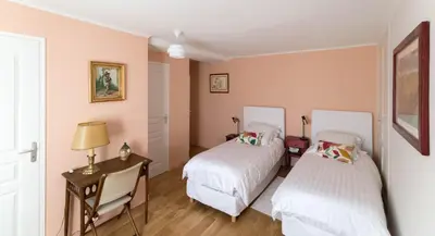 Un ou plusieurs lits dans un hébergement de l'établissement Couette et café Saumur