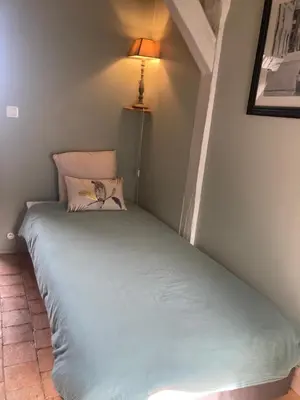 Un ou plusieurs lits dans un hébergement de l'établissement Chambre Sixtine