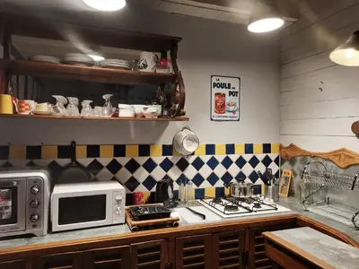 Cuisine ou kitchenette dans l'établissement Charmant gîte duplex du bon accueil