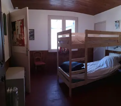 Un ou plusieurs lits dans un hébergement de l'établissement Le gîte du loir à vélo, gîte d'étape, maison de campagne